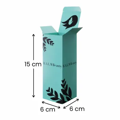 6 x 6 x 15 cm This is a custom teal-colored cardboard box with the text 'B.A.L.M Beauty' and decorative leaf patterns, likely for beauty product packaging.